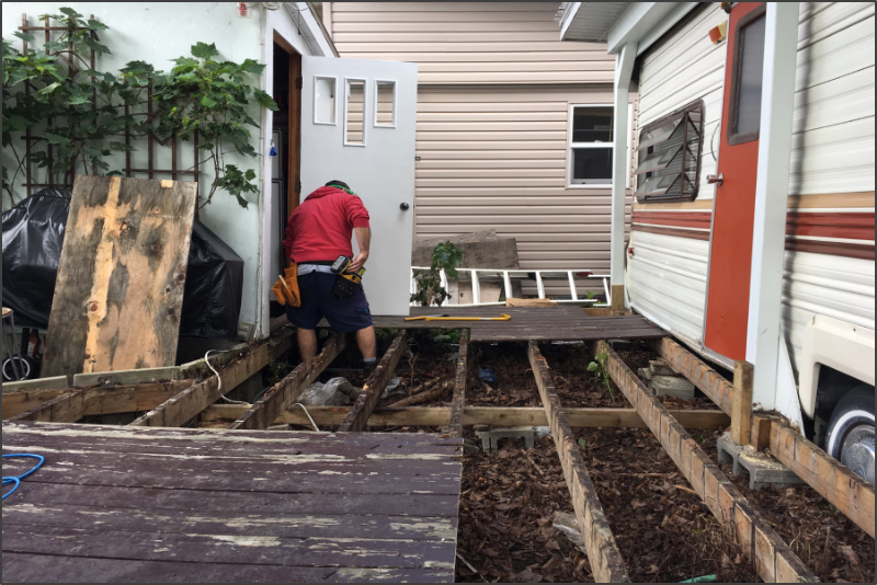 Photo of working on a deck.